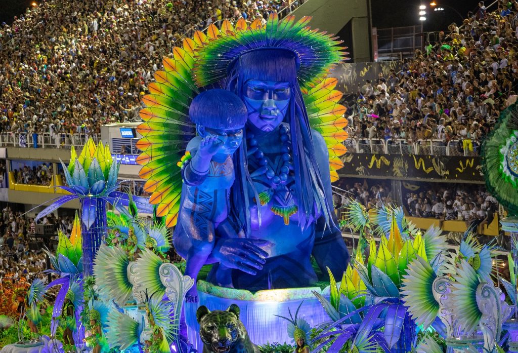 A float for the samba parade depicting a mother and child carved in blue and framed with feathers