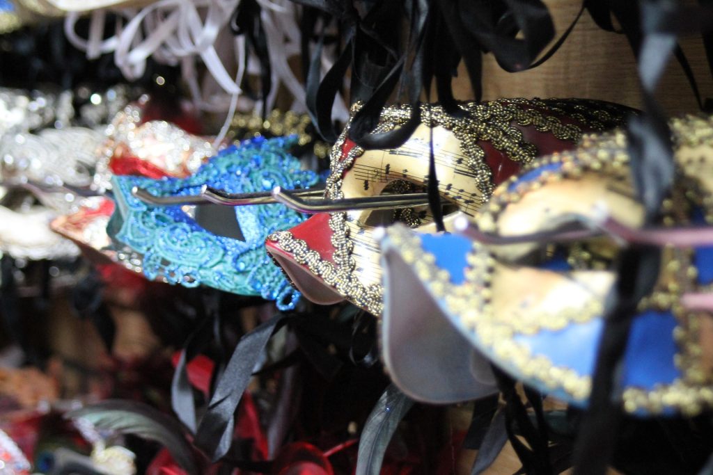 Colourful decorative masquerade masks displayed for Mardi Gras celebrations